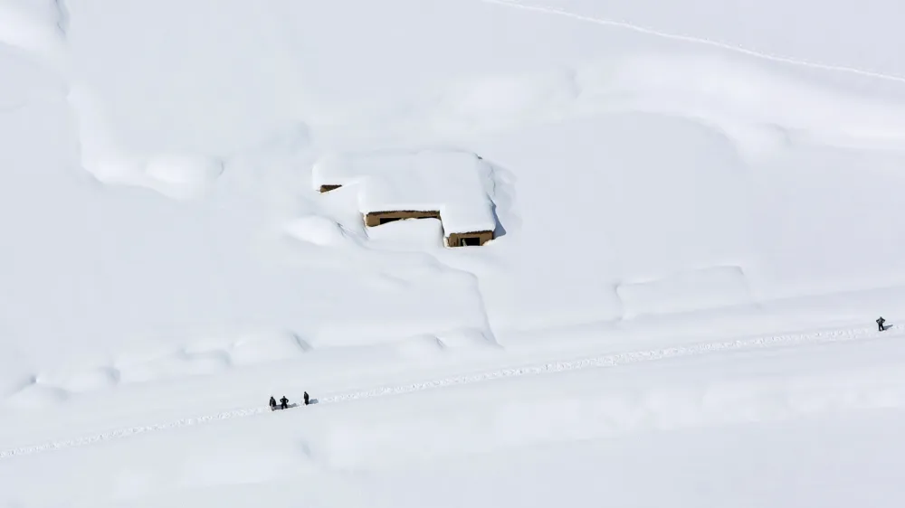 ﻿A house is covered with snow from an avalanche in the Paryan district of Panjshir province, north of Kabul, Afghanistan, Friday, Feb. 27, 2015. The death toll from severe weather that caused avalanches and flooding across much of Afghanistan has jumped to more than 200 people, and the number is expected to climb with cold weather and difficult conditions hampering rescue efforts, relief workers and U.N. officials said Friday. (AP Photo/Rahmat Gul)