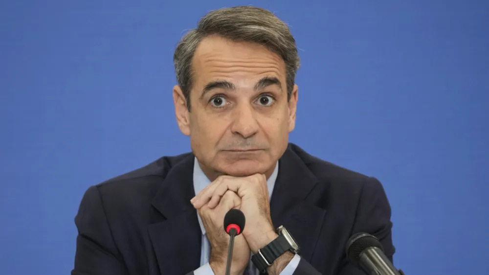 Greek Prime Minister Kyriakos Mitsotakis listens a question during a news conference, in Athens, Monday, Jan. 23, 2023. Mitsotakis voiced optimism that Greek government bonds can regain investment grade within 2023, which would ease the country's borrowing costs. (AP Photo/Petros Giannakouris)