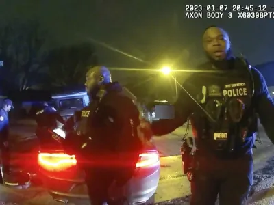 The image from video released on Jan. 27, 2023, by the City of Memphis, shows police officers talking after a brutal attack on Tyre Nichols by five Memphis police officers on Jan. 7, 2023, in Memphis, Tenn. Nichols died on Jan. 10. The five officers have since been fired and charged with second-degree murder and other offenses. (City of Memphis via AP)