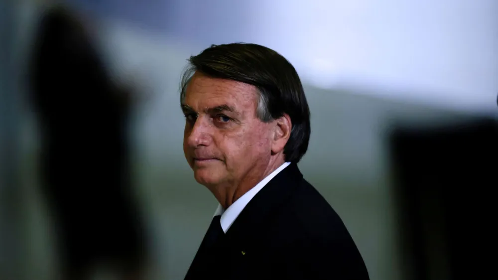 FILE PHOTO: Brazil's President Jair Bolsonaro looks on after a ceremony about the National Policy for Education at the Planalto Palace in Brasilia, Brazil June 20, 2022. REUTERS/Ueslei Marcelino/File Photo