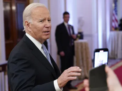 FILE - President Joe Biden talks with reporters after speaking in the East Room of the White House in Washington, Jan 20, 2023. A new poll shows that more U.S. adults disapprove than approve of the way President Joe Biden has handled the discovery of classified documents at his home and former office. Yet that seems to have had little impact on Biden's overall approval rating. (AP Photo/Susan Walsh, File)