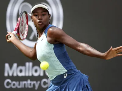 FILE - Alycia Parks from the United States returns the ball to Ons Jabeur from Tunisia during their WTA tournament round of 16 tennis match in Berlin, Germany, June 16, 2022. On Sunday, Feb. 5, 2023, Parks secured a stunning 7-6 (7), 7-5 upset win over WTA Finals champion Caroline Garcia in the Open Métropole de Lyon final to clinch her first career title. (AP Photo/Michael Sohn, File)