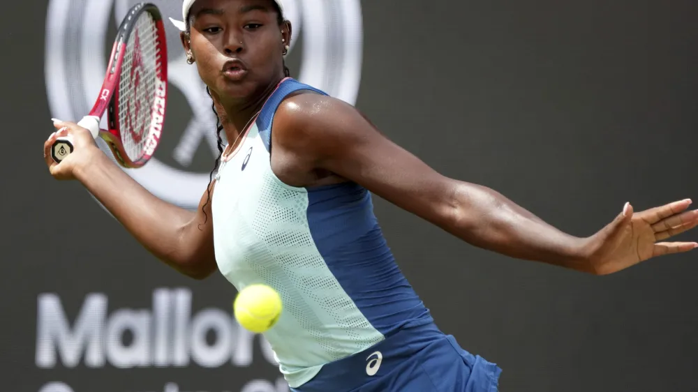 FILE - Alycia Parks from the United States returns the ball to Ons Jabeur from Tunisia during their WTA tournament round of 16 tennis match in Berlin, Germany, June 16, 2022. On Sunday, Feb. 5, 2023, Parks secured a stunning 7-6 (7), 7-5 upset win over WTA Finals champion Caroline Garcia in the Open Métropole de Lyon final to clinch her first career title. (AP Photo/Michael Sohn, File)