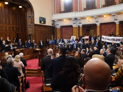 Lawmakers hold pictures of assassinated Kosovo Serb politician Oliver Ivanovic and banners that read: "Not to the ultimatum!" and "Vucic, betrayed Kosovo", during a special session of Serbia's parliament about the negotiating process with Kosovo in Belgrade, Serbia, February 2, 2023. REUTERS/Zorana Jevtic.