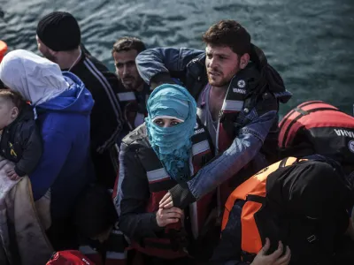 A vessel of the European border agency, Frontex, arrives carrying refugees and migrants after a rescue operation near the northeastern Greek island of Lesbos, in Mytilene, Greece, Tuesday, Feb. 23, 2016. Nearly 100,000 migrants and refugees have traveled to Greek islands from nearby Turkey so far this year. (AP Photo/Manu Brabo)