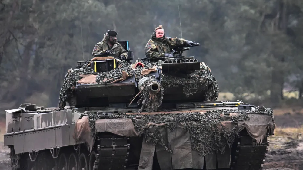 German Defense Minister Boris Pistorius rides a tank as he visits the Leopard II tanks that are due to be supplied to Ukraine at the tank brigade Lipperland of Germany's army and part of the Bundeswehr, in Augustdorf, Germany, February 1, 2023. REUTERS/Benjamin Westhoff