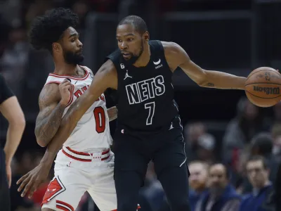 FILE - Brooklyn Nets' Kevin Durant (7) looks to drive against Chicago Bulls' Coby White (0) during the second half of an NBA basketball game Wednesday, Jan. 4, 2023, in Chicago. Chicago won 121-112. The Phoenix Suns pulled a midnight blockbuster on Wednesday, Feb. 9, 2023, acquiring 13-time All-Star Durant from the Brooklyn Nets, according to multiple reports. (AP Photo/Paul Beaty, File)