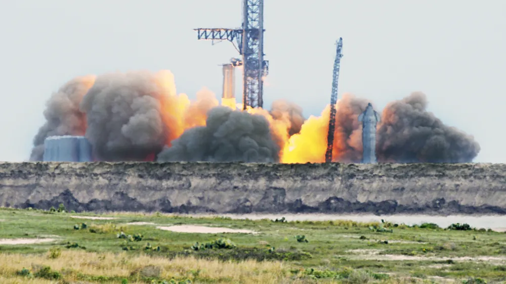 SpaceX ignites 31 out of 33 raptor engines during a Starship booster static fire test Thursday, Feb. 9, 2023, at SpaceX Starbase, Texas launch pad near Boca Chica Beach, Texas. SpaceX is a big step closer to sending its giant Starship spacecraft into orbit, completing an engine-firing test at the launch pad on Thursday.(Miguel Roberts/The Brownsville Herald via AP)