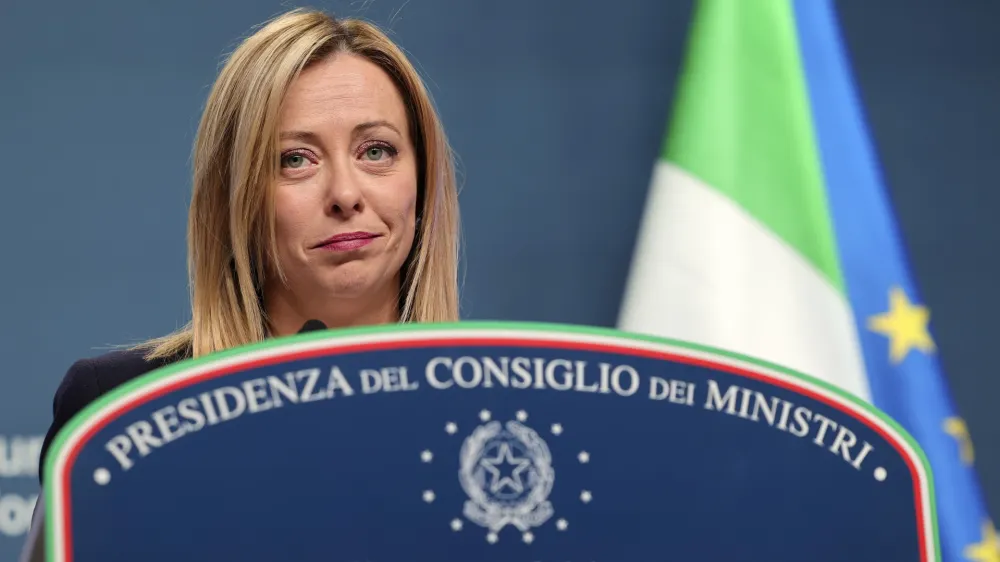 Italy's Prime Minister Giorgia Meloni speaks during a media conference at the European Council building in Brussels, Friday, Feb. 10, 2023. (AP Photo/Olivier Matthys)