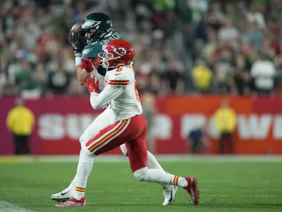 Philadelphia Eagles tight end Dallas Goedert (88) catches a pass while defended by Kansas City Chiefs safety Bryan Cook (6) during the second half of the NFL Super Bowl 57 football game, Sunday, Feb. 12, 2023, in Glendale, Ariz. (AP Photo/Abbie Parr)