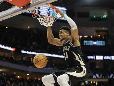 Milwaukee Bucks forward Giannis Antetokounmpo (34) dunks against the Boston Celtics during an NBA basketball game, Tuesday, Feb. 14, 2023, in Milwaukee. (AP Photo/Jeffrey Phelps)