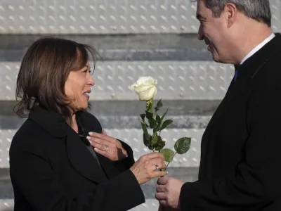 Bavarian State Governor Markus Soeder, right, welcomes U.S. Vice President Kamala Harris during her arrival for the Munich Security Conference at the airport in Munich, Germany, Thursday, Feb. 16, 2023. The conference will take place there from Friday to Sunday. (AP Photo/Michael Probst)