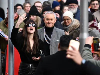 Cast member Anne Hathaway reacts as she arrives for a photocall and a news conference to promote the movie 'She Came to Me' at the 73rd Berlinale International Film Festival in Berlin, Germany, February 16, 2023. REUTERS/Annegret Hilse