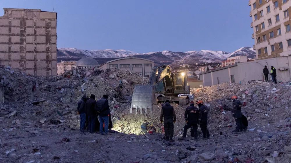 A rescue team searches for an 11-year-old girl from the rubble of their home following the deadly earthquake, in Kahramanmaras, Turkey, February 16, 2023. REUTERS/Eloisa Lopez