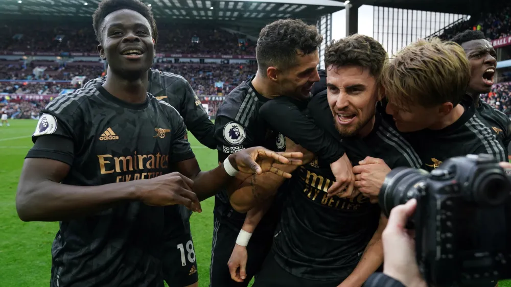 18 February 2023, United Kingdom, Birmingham: Arsenal's Jorginho celebrates his sides third goal, an own goal by Aston Villa goalkeeper Emiliano Martinez during the English Premier League soccer match between Aston Villa and Arsenal at the Villa Park. Photo: Nick Potts/PA Wire/dpa