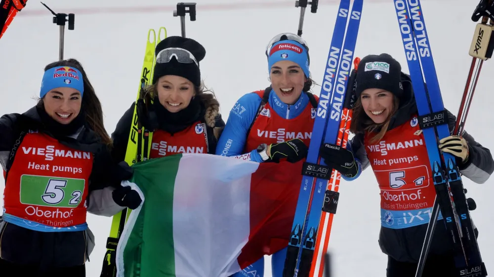 Biathlon - Biathlon World Championship - Oberhof, Germany - February 18, 2023 Italy's Samuela Comola, Dorothea Wierer, Hannah Auchentaller and Lisa Vittozzi celebrate after winning the women's 4x6km relay competition REUTERS/Lisa Leutner