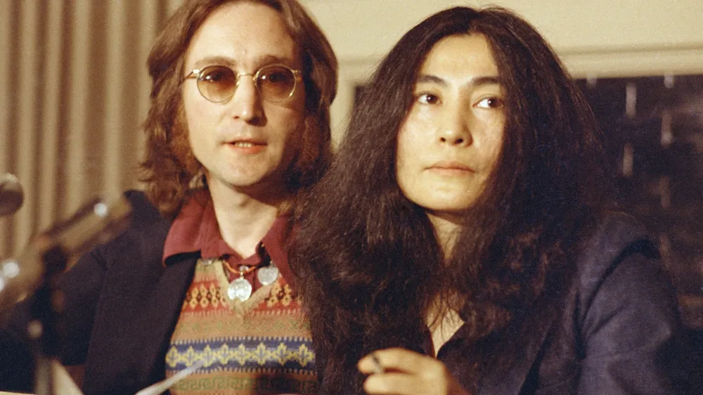 Former Beatle John Lennon and his wife, Yoko Ono, speak at a news conference in New York City, April 2, 1973. Lennon said he has appealed a federal deportation decision orderng him to leave the country in less than two months. His lawyer said the legal action could keep Lennon in the country for years. (AP Photo)