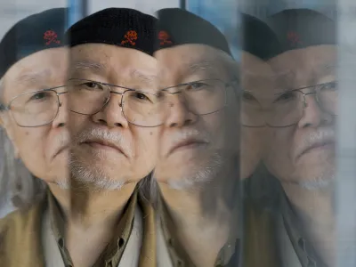 FILE - Manga artist Leiji Matsumoto poses for portraits at the 70th edition of the Venice Film Festival held from Aug. 28 through Sept. 7, in Venice, Italy, on Sept. 3, 2013. Matsumoto died of acute heart failure in a Tokyo hospital on Feb. 13, 2023, his office, Studio Leijisha, said Monday, Feb. 20, 2023. (AP Photo/Domenico Stinellis, File)