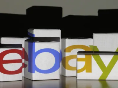 An eBay logo is projected onto white boxes in this illustration picture taken in Warsaw, January 21, 2014. eBay the world's second largest Internet retailer expected to post a 16% profit increase in its fourth quarter January 22, 2014. Picture taken January 21. REUTEwhite RS/Kacper Pempel (POLAND - Tags: BUSINESS)