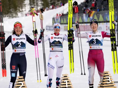 First place, Norway's Gyda Hansen Westvold, center, poses with second place, Germany's Nathalie Armbruster, left, and third place, Japan's Haruka Kasai during the Women's Nordic Combined Gundersen Normal Hill HS100/5km at the Nordic World Ski Championships in Planica, Slovenia, Friday, Feb. 24, 2023. (AP Photo/Darko Bandic)