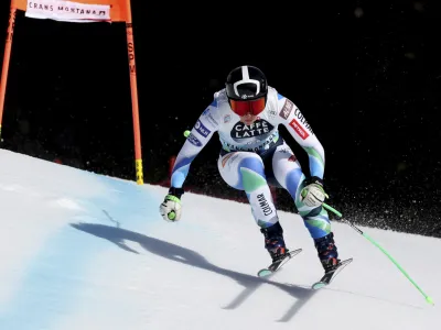 Slovenia's Ilka Stuhec speeds down the course during an alpine ski, women's World Cup downhill training in Crans Montana, Switzerland, Friday, Feb. 24, 2023. (AP Photo/Alessandro Trovati)