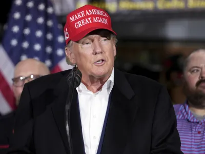 FILE - Former President Donald Trump speaks at the East Palestine Fire Department as he visits the area in the aftermath of the Norfolk Southern train derailment Feb. 3 in East Palestine, Ohio, Wednesday, Feb. 22, 2023. Trump's lawyers in Georgia are criticizing the Fulton County investigation into potential illegal election meddling after the foreperson of the special grand jury seated to help the probe went public this week. (AP Photo/Matt Freed, File)