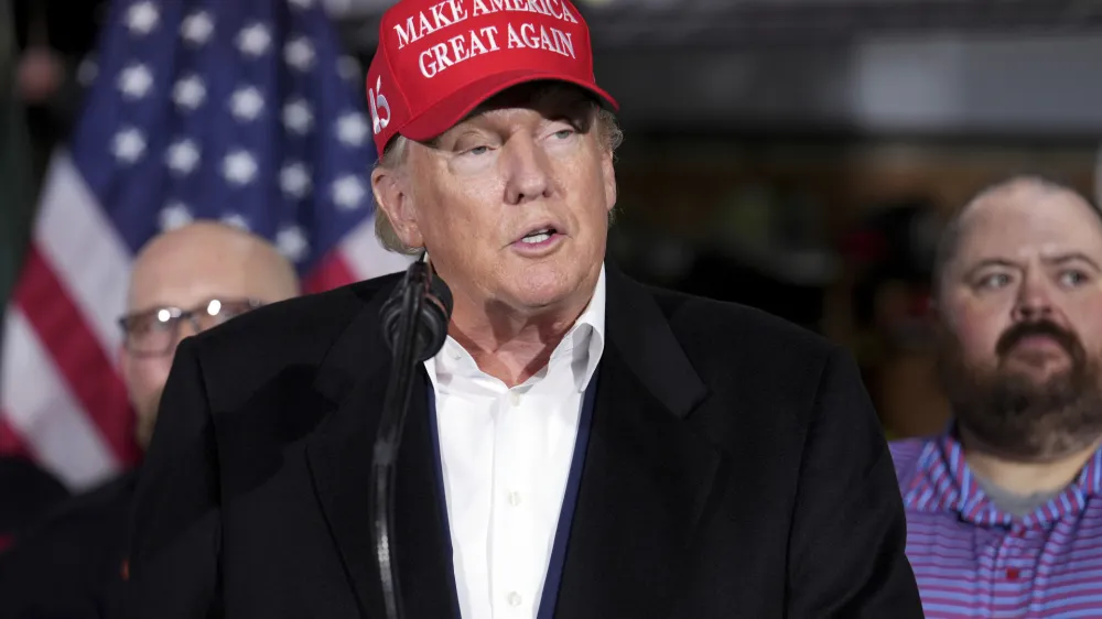 FILE - Former President Donald Trump speaks at the East Palestine Fire Department as he visits the area in the aftermath of the Norfolk Southern train derailment Feb. 3 in East Palestine, Ohio, Wednesday, Feb. 22, 2023. Trump's lawyers in Georgia are criticizing the Fulton County investigation into potential illegal election meddling after the foreperson of the special grand jury seated to help the probe went public this week. (AP Photo/Matt Freed, File)