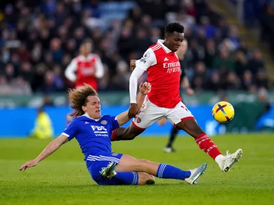 25 February 2023, United Kingdom, Leicester: Leicester City's Wout Faes (L) and Arsenal's Eddie Nketiah fight for the ball during the English Premier League soccer match between Leicester City and Arsenal at the King Power Stadium. Photo: Nick Potts/PA Wire/dpa