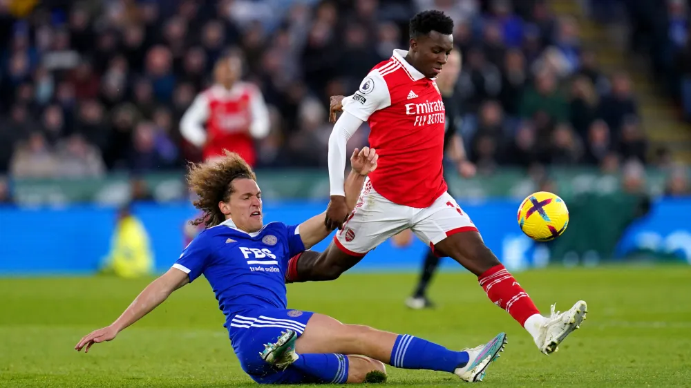 25 February 2023, United Kingdom, Leicester: Leicester City's Wout Faes (L) and Arsenal's Eddie Nketiah fight for the ball during the English Premier League soccer match between Leicester City and Arsenal at the King Power Stadium. Photo: Nick Potts/PA Wire/dpa