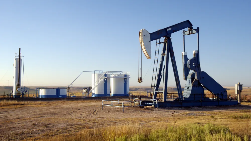 Oil well and storage tanks in the Texas Panhandle.