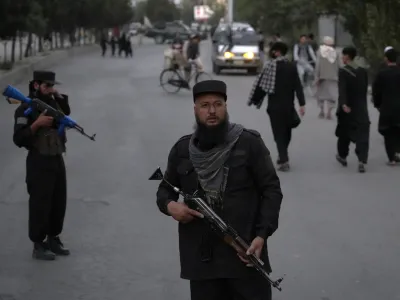 Taliban fighters stand guard in the Shiite neighborhood of Dasht-e-Barchi, in Kabul, Afghanistan, Sunday, Aug. 7, 2022. (AP Photo/Ebrahim Noroozi)