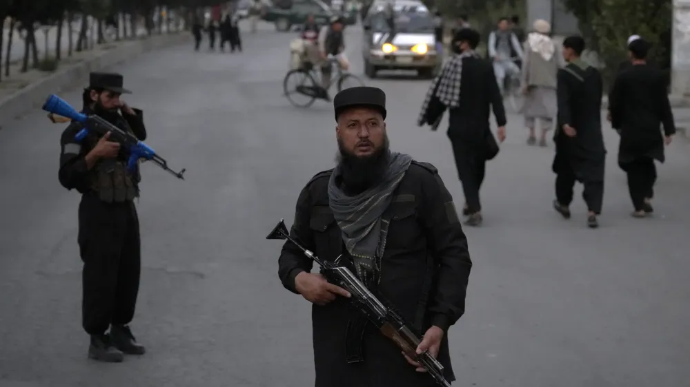 Taliban fighters stand guard in the Shiite neighborhood of Dasht-e-Barchi, in Kabul, Afghanistan, Sunday, Aug. 7, 2022. (AP Photo/Ebrahim Noroozi)