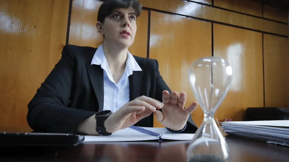 ﻿In this photo taken on Friday, Oct. 4, 2019, Laura Codruta Kovesi, Romania's former chief anti-corruption prosecutor who will direct the European Public Prosecutor's Office (EPPO) - tasked with investigating fraud connected to the use of EU funds and other financial crimes, speaks during an interview with the Associated Press, in Bucharest, Romania. For Kovesi, opposition to her successful candidacy to become the European Unionâ€™s first chief prosecutor came from a familiar source - her own countryâ€™s government. Kovesi spent five years as head of the Romanian Anticorruption Directorate and those indicted by her office included 14 Cabinet members, 53 lawmakers and a member of the European Parliament. (AP Photo/Vadim Ghirda)