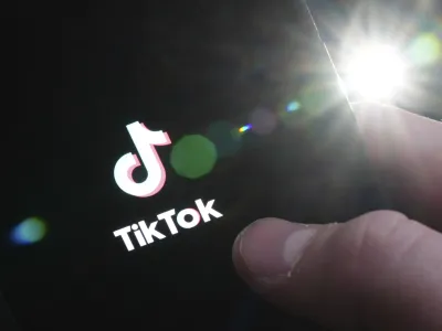 The TikTok startup page is displayed on an iPhone in Ottawa, Ontario, Monday, Feb. 27, 2023. The federal government is banning TikTok from its mobile devices just days after federal and provincial privacy commissioners launched an investigation into the social media platform. (Sean Kilpatrick/The Canadian Press via AP)