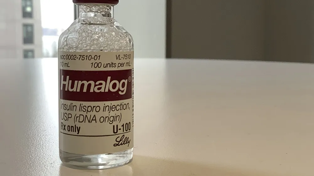 This Wednesday, March 1, 2023 photo shows a vial of Eli Lilly's Humalog insulin in New York. Eli Lilly will cut prices for some older insulins later this year and immediately give more patients access to a cap on costs they pay to fill prescriptions. The moves announced March 1, 2023 promise critical relief to some people with diabetes who can face annual costs of more than $1,000 for insulin they need in order to live. Lilly's changes also come as lawmakers and patient advocates pressure drugmakers to do something about soaring prices. (AP Photo/Pablo Salinas)