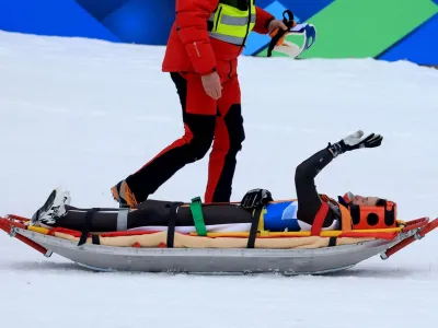 Nordic Skiing - FIS Nordic World Ski Championships - Planica, Slovenia - March 1, 2023 Slovenia's Peter Prevc is taken on a stretchered after sustaining an injury during training REUTERS/Borut Zivulovic