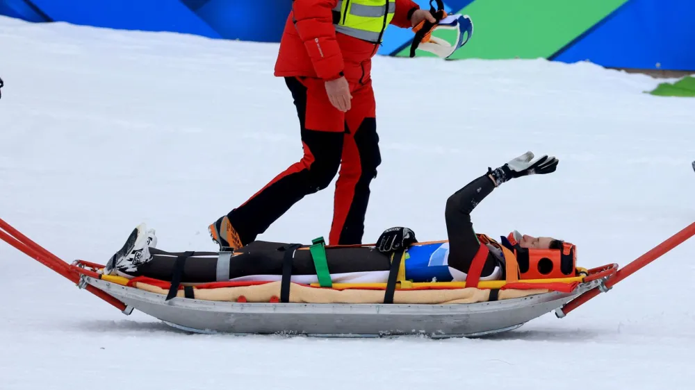 Nordic Skiing - FIS Nordic World Ski Championships - Planica, Slovenia - March 1, 2023 Slovenia's Peter Prevc is taken on a stretchered after sustaining an injury during training REUTERS/Borut Zivulovic