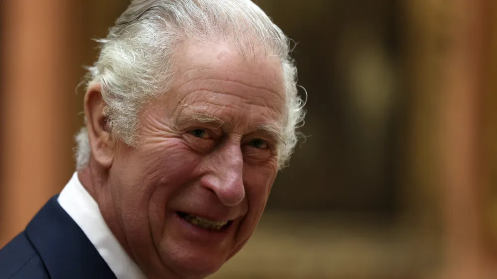 FILE - Britain's King Charles III meets members of the Westend Gospel Choir after a ceremony commemorating the 50th anniversary of the Resettlement of British Asians from Uganda in the U.K., at Buckingham Palace in London on Nov. 2, 2022. Two senior clergymen in Jerusalem on Friday March 3, 2023, consecrated the holy oil that will be used to anoint King Charles III during his coronation, as the Anglican Church seeks to underscore the monarchy's long history and the royal family's links to the Middle East. (Isabel Infantes/Pool via AP, File)