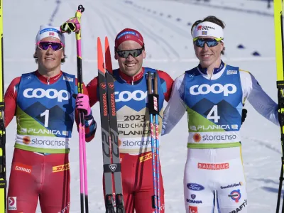 Winner Norway's Paal Golberg, center, poses besides second placed Norway's Johannes Hoesflot Klaebo, left, and third placed Sweden's William Poromaa after the Men's Mass Start 50km Classic race at the Nordic World Championships in Planica, Slovenia, Sunday, March 5, 2023. (AP Photo/Darko Bandic)