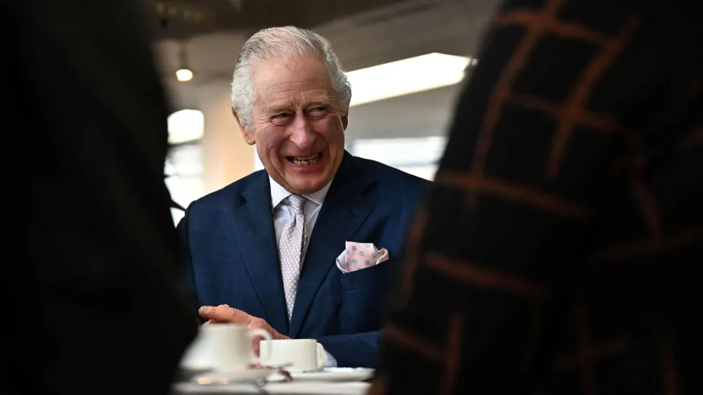 Britain's King Charles III meets with volunteers and service users of the charity organisation Age UK, during an afternoon tea at the Colchester Library during a visit in Colchester, Britain on March 7, 2023.   BEN STANSALL/Pool via REUTERS