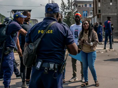 Congolese police talk to demonstrators calling on authorities to enforce an agreed withdrawal of M23 rebels from occupied territory in the region, within Goma in the North Kivu province of the Democratic Republic of Congo January 18, 2023. REUTERS/Djaffar Sabiti