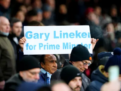 11 March 2023, United Kingdom, London: A Manchester City fan holds up a sign in support of Match of the Day presenter Gary Lineker during the English Premier League soccer match between Crystal Palace and Manchester City at Selhurst Park. Photo: Zac Goodwin/PA Wire/dpa