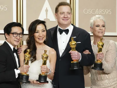 Ke Huy Quan, from left, Michelle Yeoh, Brendan Fraser and Jamie Lee Curtis pose with their awards in the press room at the Oscars on Sunday, March 12, 2023, at the Dolby Theatre in Los Angeles. Brendan Fraser, third from left, won best performance by an actor in a leading role for "The Whale." Ke Huy Quan, from left, Michelle Yeoh and Jamie Lee Curtis all won for their leading and supporting roles in "Everything Everywhere All at Once." (Photo by Jordan Strauss/Invision/AP)