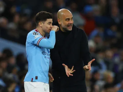 Soccer Football - Champions League - Round of 16 - Second Leg - Manchester City v RB Leipzig - Etihad Stadium, Manchester, Britain - March 14, 2023 Manchester City manager Pep Guardiola with Julian Alvarez before he comes on as a substitute REUTERS/Molly Darlington