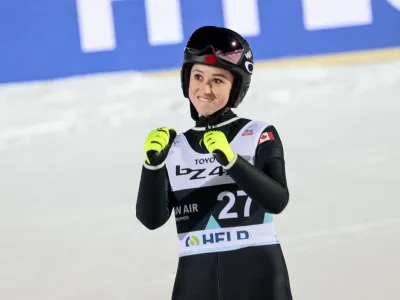 Alexandria Loutitt from Canada celebrates after finishing on 3rd position on the women's ski jumping competition in Lysgardsbakken in Lillehammer, Norway, Wednesday March 15, 2023. (Geir Olsen/NTB Scanpix via AP)