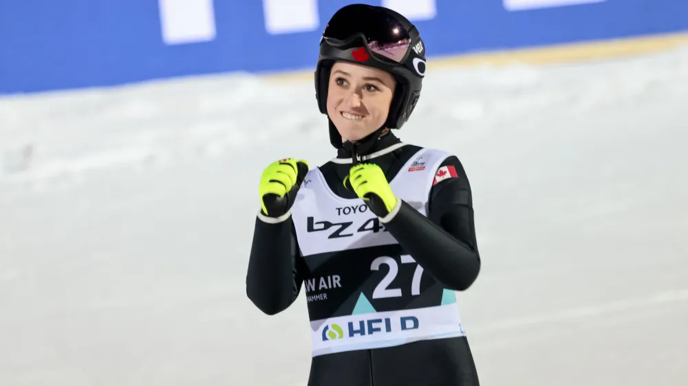 Alexandria Loutitt from Canada celebrates after finishing on 3rd position on the women's ski jumping competition in Lysgardsbakken in Lillehammer, Norway, Wednesday March 15, 2023. (Geir Olsen/NTB Scanpix via AP)