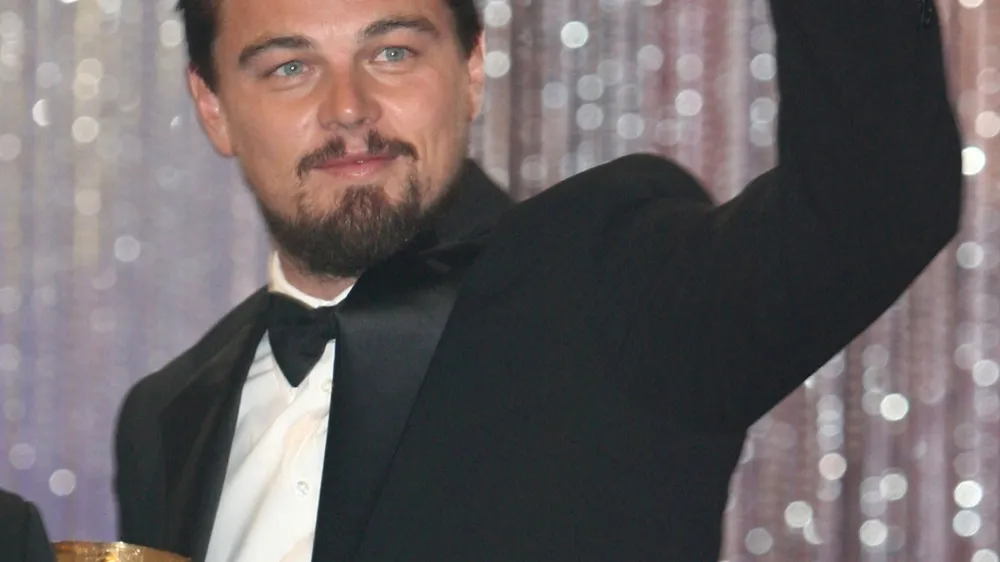 **FILE** American actor Leonardo Di Caprio gestures after receiving an award for his lifetime career during the opening of the seventh Marrakesh Film Festival, in this Dec. 7, 2007, file photo, in Marrakesh, Morocco. DiCaprio's neighbors will have to show more proof if they want to sue him for building a basketball court they claim destabilized their California property, a judge ruled. For the second time in three months, the judge said Thursday, Jan. 3, 2008, the complaint seeking at least $250,000 (euro169,457) in damages is not complete enough to go forward.  (AP Photo/Abdeljalil Bounhar, file)