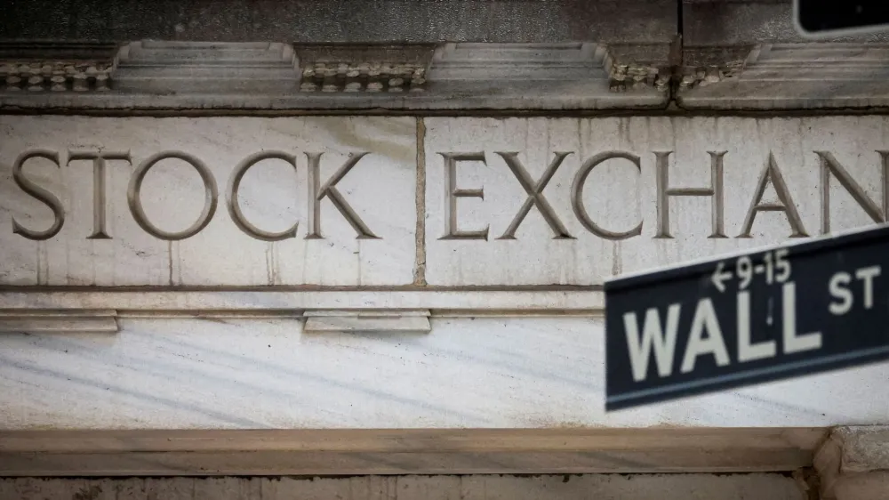 FILE PHOTO: The Wall Street entrance to the New York Stock Exchange (NYSE) is seen in New York City, U.S., November 15, 2022. REUTERS/Brendan McDermid/File Photo/File Photo