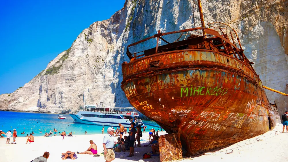 Zakynthos, Greece, Nov-2021: Ship Wreck at Navagio bay and Ship Wreck beach in summer. The most famous natural landmark of Zakynthos