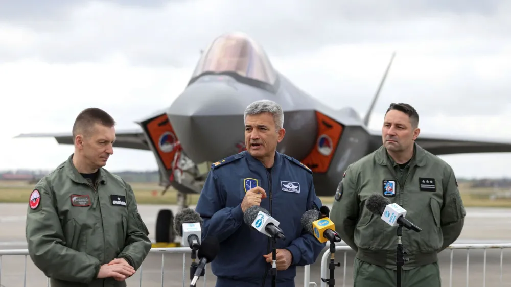 Brigadier General Ireneusz Nowak and Brigadier General Omer Nafiz Gulmezoglu speak to the media during a NATO media event at an airbase in Malbork, Poland, March 21, 2023. REUTERS/Lukasz Glowala